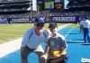 Marty Schottenheimer Poses With A Young Fan As Chargers Head Coach