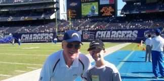 Marty Schottenheimer Poses With A Young Fan As Chargers Head Coach
